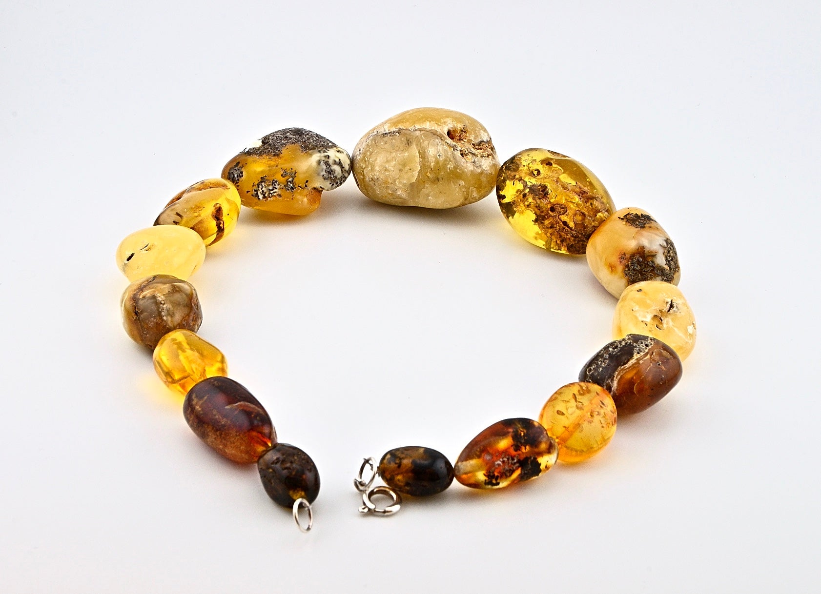 Big Ball Rack Amber Necklace is handmade from Natural Baltic Amber  Color: Milky-Yellow, Clear-Yellow-Cognac with natural Ingrowth and Mosaic, half Mat and half Transparent  Clasp: Sterling Silver Lobster Claw&nbsp;  Weight: 142g / 5oz